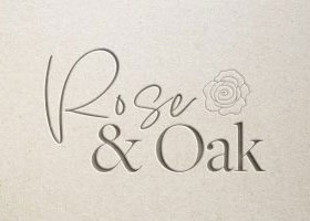 Embossed logo mockup for Rose & Oak featuring elegant script lettering and a rose illustration