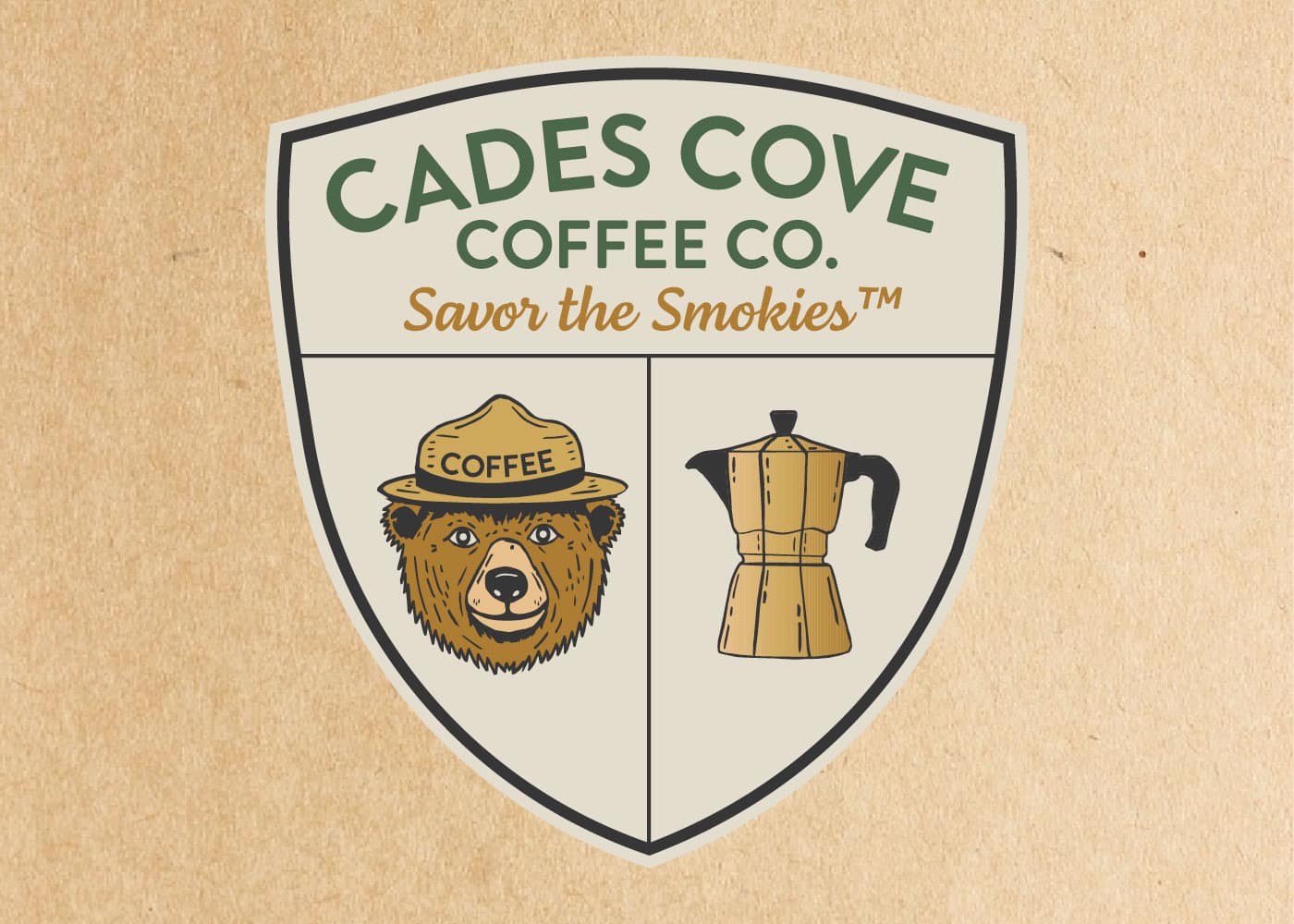 Cades Cove Coffee Co. shield logo mockup with bear and moka pot on kraft paper background