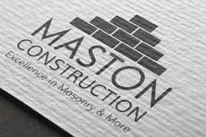 Maston Construction logo mockup with brick pattern icon on textured paper